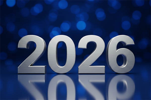 eine silberne Jahreszahl "2026" vor dunkelblauem Hintergrund